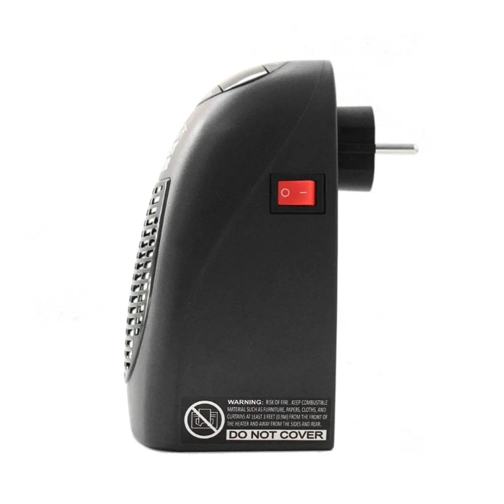 Black compact ceramic electric heater with digital display and a rotating plug on a desk.