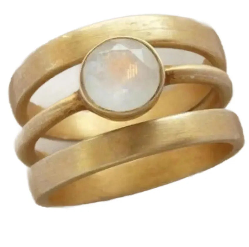Gold-plated titanium steel ring with a white chalcedony stone in a hollow micro-inlaid geometric setting.