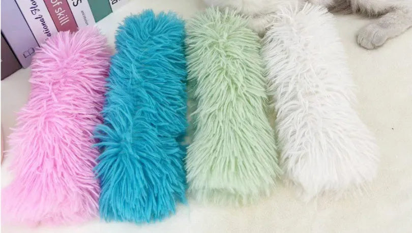 Blue, green, pink, and white cat plush toy pillows measuring 27cm by 10cm.