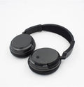 Black stereo wireless headset with USB FM transmitter and 3.5mm audio cable for wired connection.