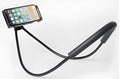 White neck phone holder with 360-degree rotating clamp holding a smartphone, showing it can be worn around the neck.