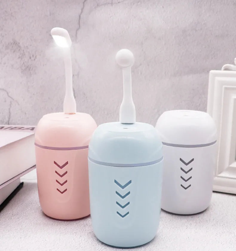 Blue columnar portable car humidifier with USB cable and aromatherapy function.