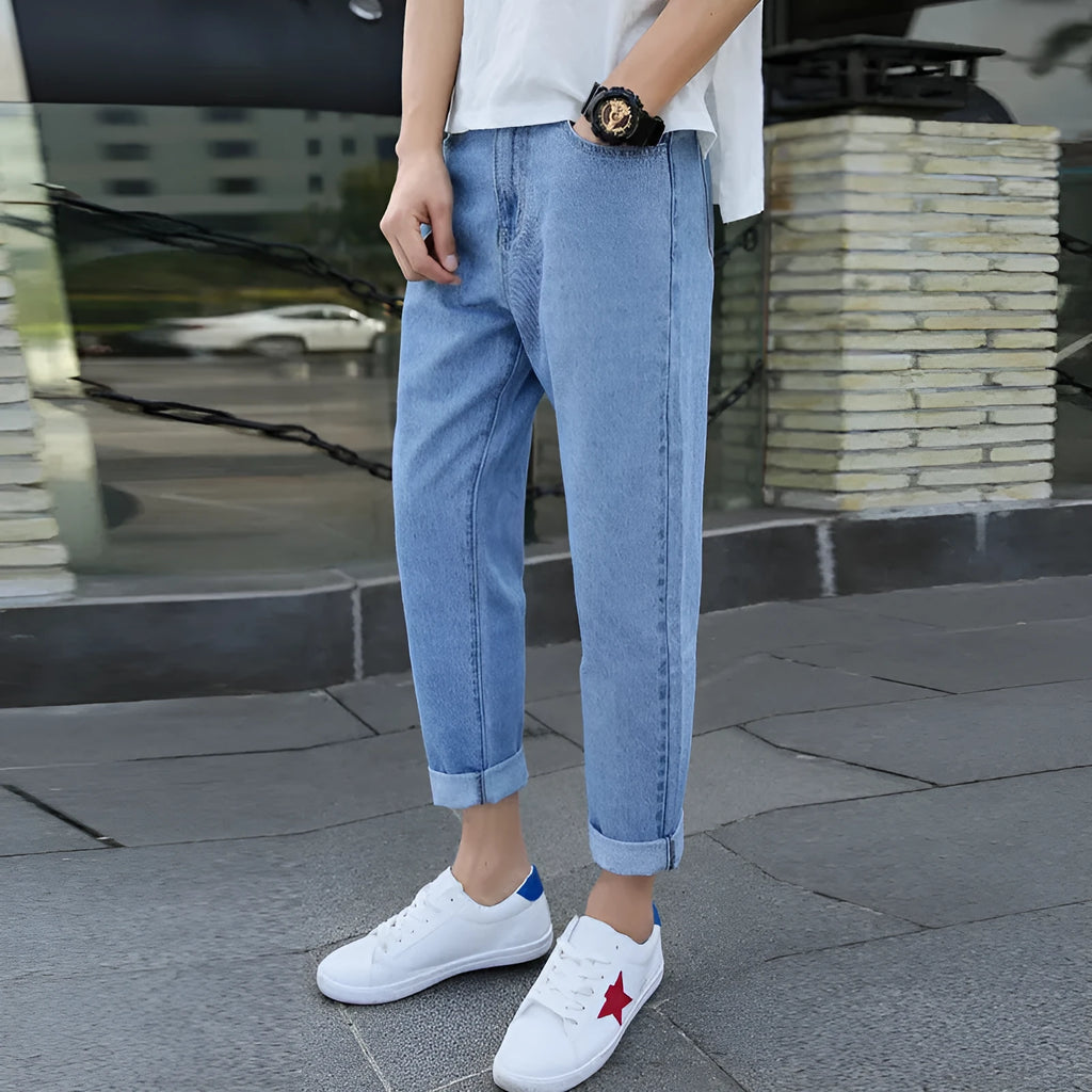 Men's black and blue straight leg cotton jeans with small harem style on waist size chart