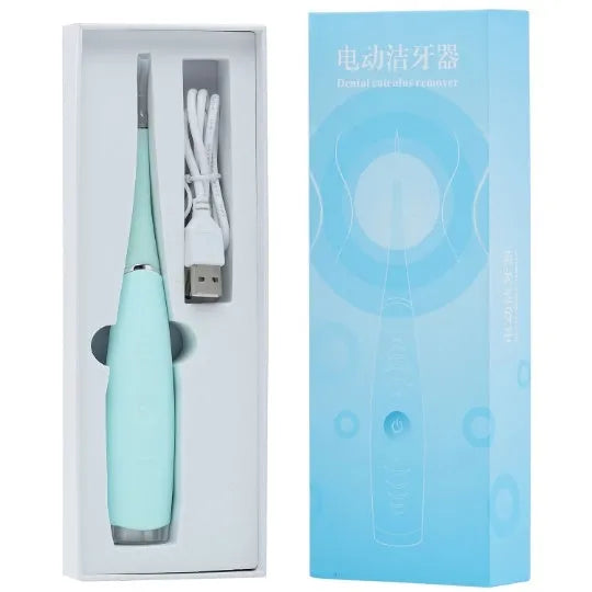 Pink and blue electric dental scaler tool with silicone handle on a bathroom counter.