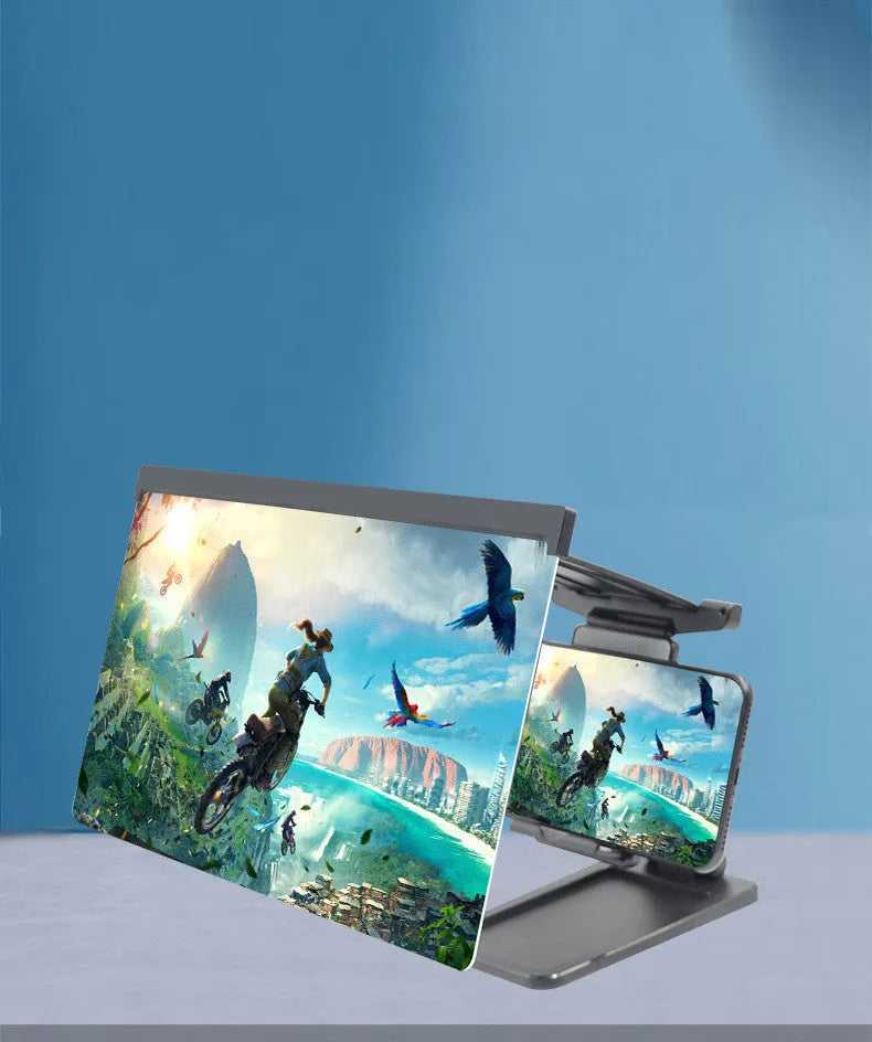 Black folding mobile phone screen magnifier with detachable holder on a desk.
