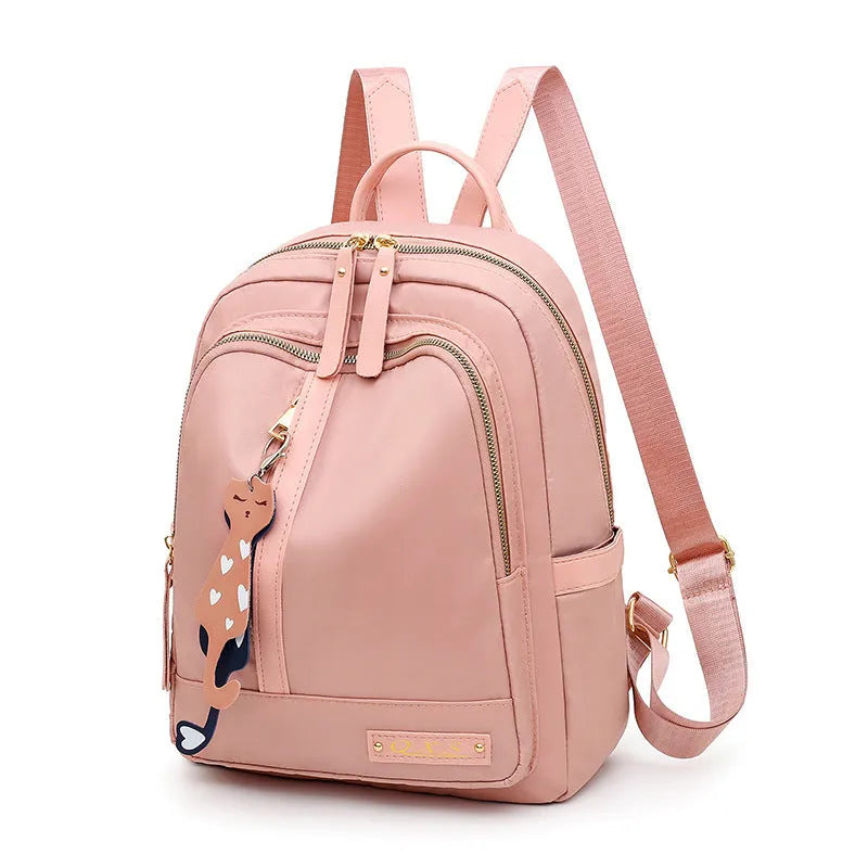 Black nylon women's casual backpack with internal pockets and double shoulder straps.