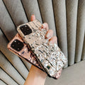 Foldable electroplated TPU iPhone case in rose gold and silver colours, shown on an iPhone.