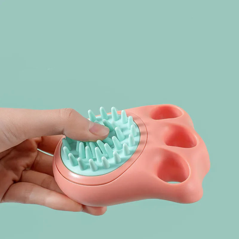 Blue silicone claw pet bath brush with non-slip handle for dog and cat grooming.