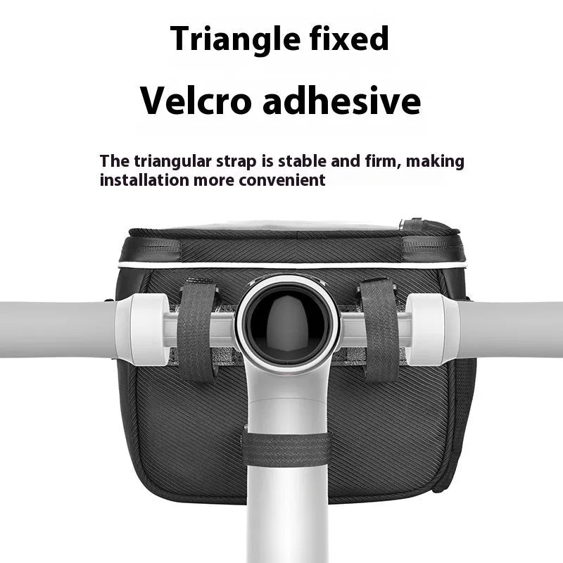 Black polyester bicycle handlebar bag with quick-release straps mounted on bicycle