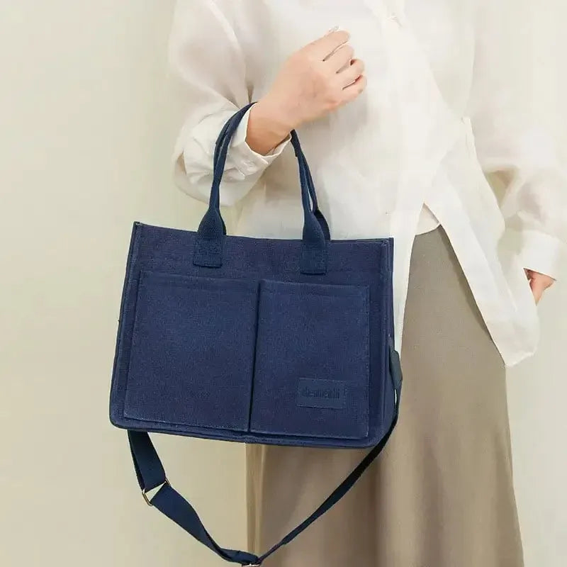 Large casual canvas tote shoulder bag for women with multiple pockets in creamy white