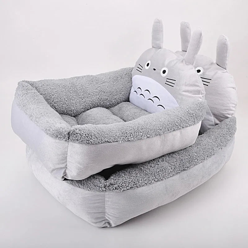 Cartoon-style plush pet bed sofa in blue, shown in small size for a dog or cat.