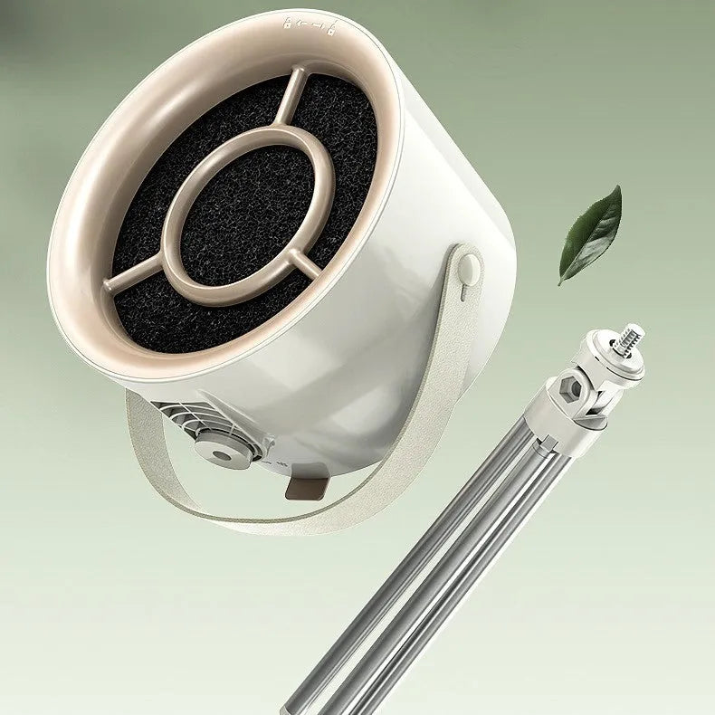Milk white portable desktop exhaust fan with USB cable and removable filter on a kitchen countertop