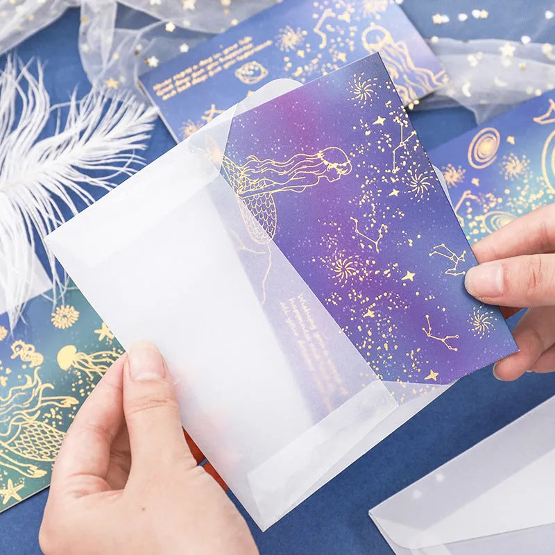 Set of three bronzing finish folding greeting card envelopes in four colour styles, measuring 13cm by 8.5cm.