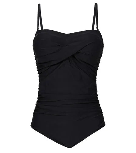 Plus size one-piece swimsuit with open back and retro wave design in black, green, and wave point colours