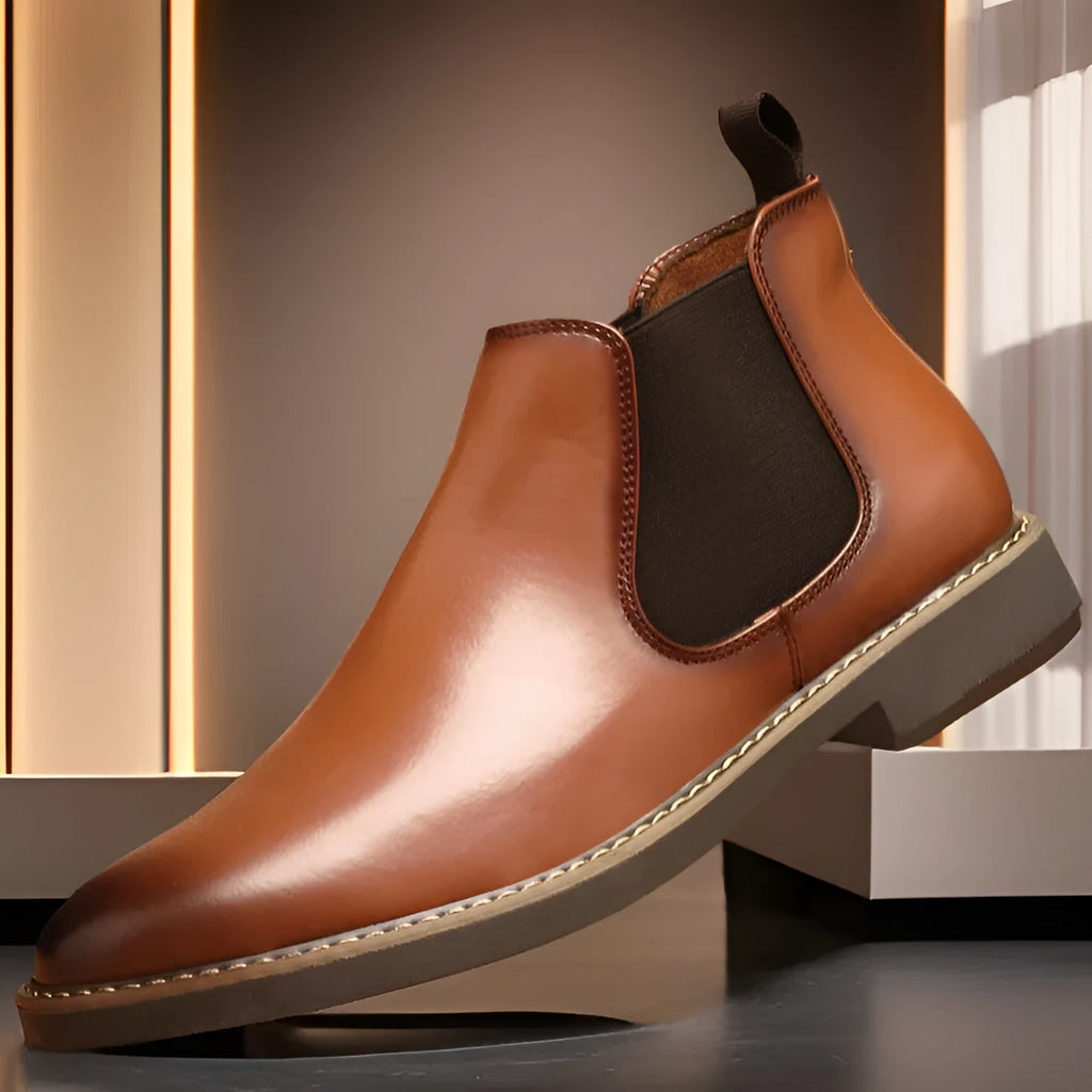 Men's black British-style chukka boot with a mid-calf height, flat square heel, and rubber sole.