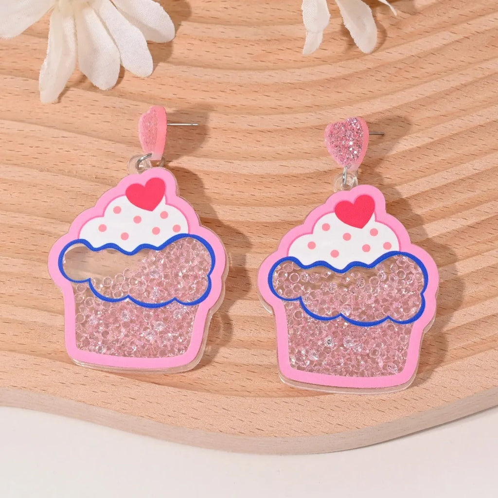 Colourful acrylic earrings with realistic fruit and dessert charms including cherry, strawberry, and ice cream.