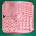 Silicone dog slow food mat in assorted colours including red, sky blue, and yellow, pet tableware for slow feeding