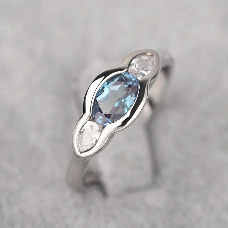 Women's geometric ellipse copper ring with inlaid zircon stone in white gold colour.