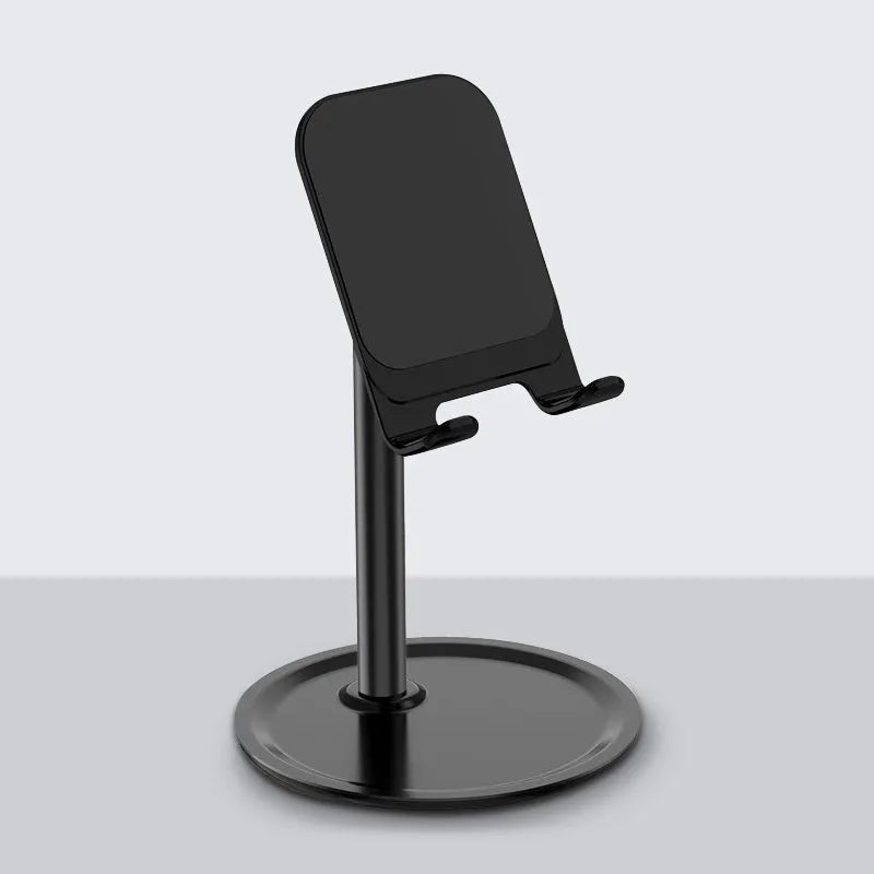 Aluminium alloy and plastic foldable stand holding a tablet on a desk