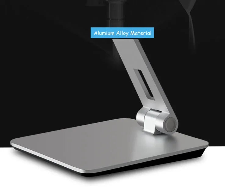 Silver foldable tablet stand showing 360-degree rotation mechanism with silicone anti-slip pads
