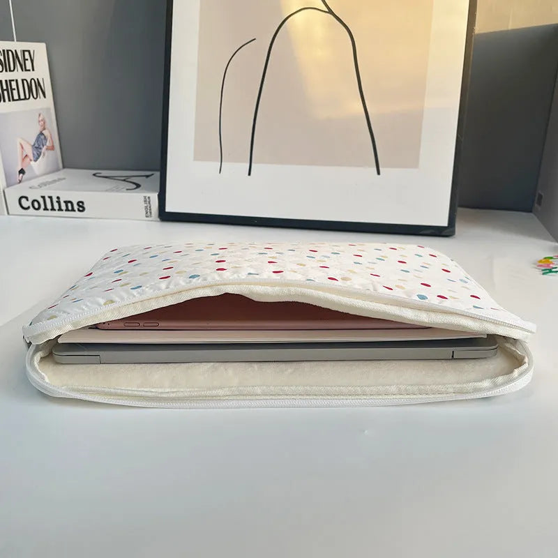 Polka dot patterned polyester laptop bag for women, shown in a solid colour with size options for 11, 13/14, and 15/15.6 inch laptops.
