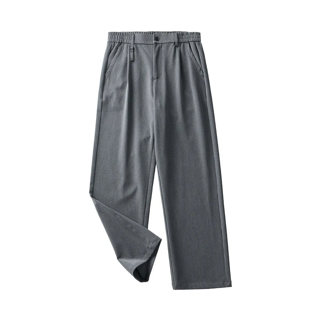Man wearing black straight-leg business casual trousers with a draping design, made from a polyester blend fabric.