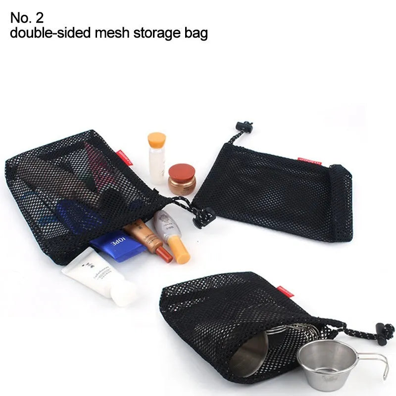 Set of five red outdoor travel storage bags with zippers and mesh panels on a plain background