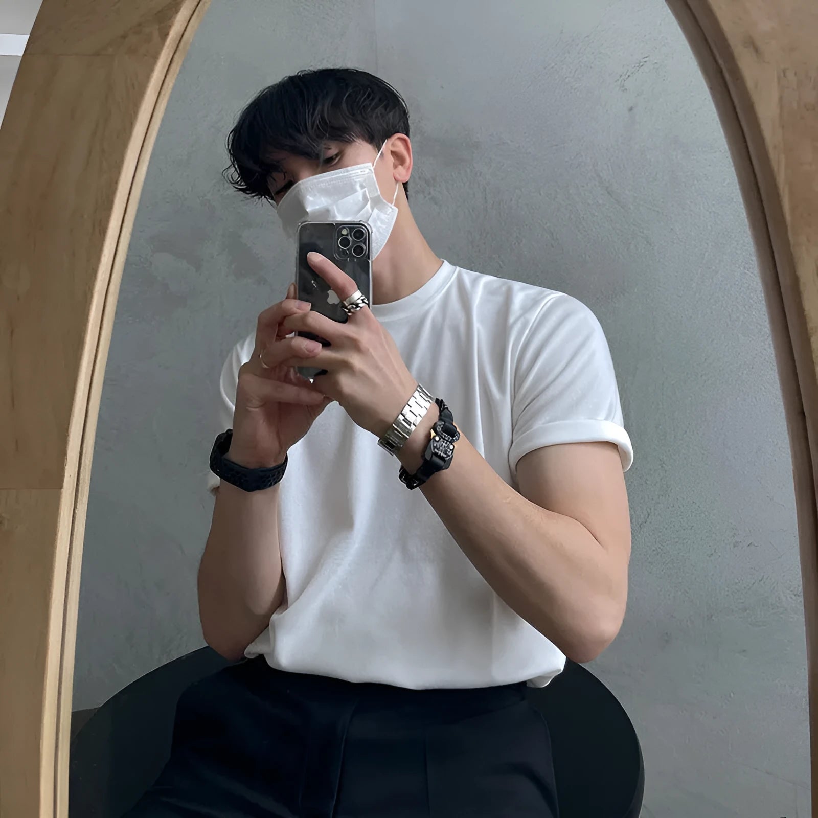 Men's slim fit black cotton t-shirt with round neck and half sleeves on a model.