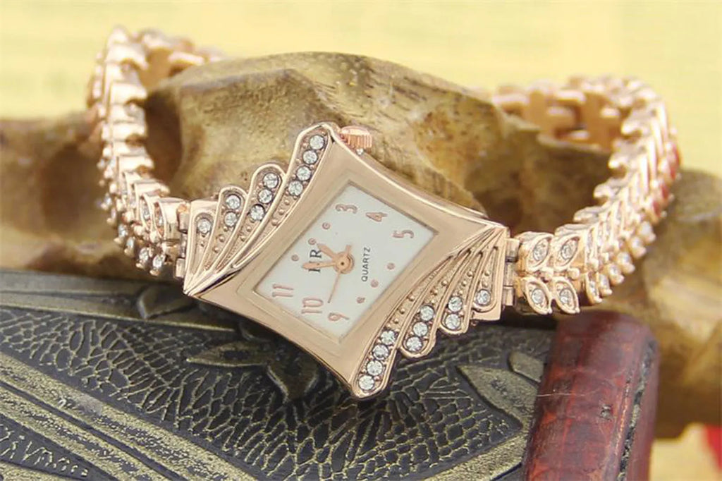 Rose gold stone paved wheat shaped metal women's wristwatch with quartz movement and 19cm band