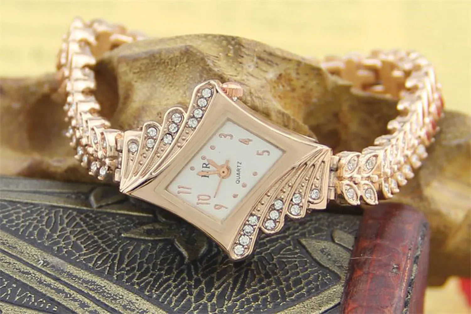 Rose gold stone paved wheat shaped metal women's wristwatch with quartz movement and 19cm band