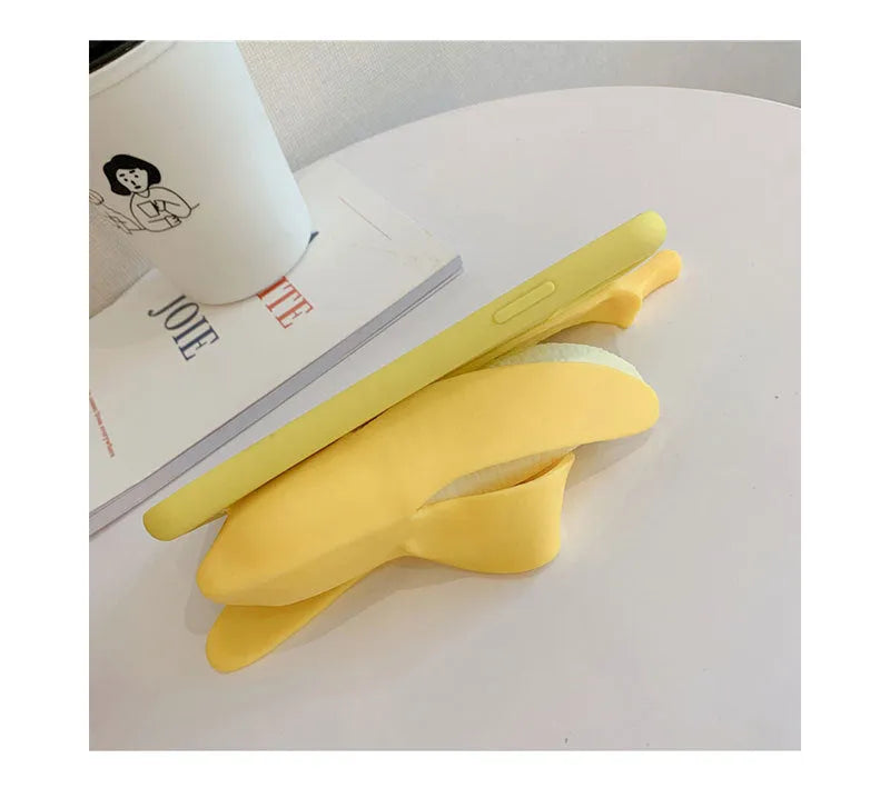 Yellow silicone banana-shaped phone case with unzip detail for iPhone models.