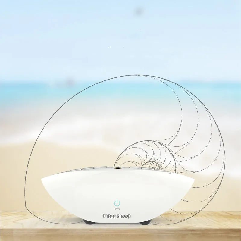White plastic white noise sleep aid machine with mechanical buttons, 22cm tall.