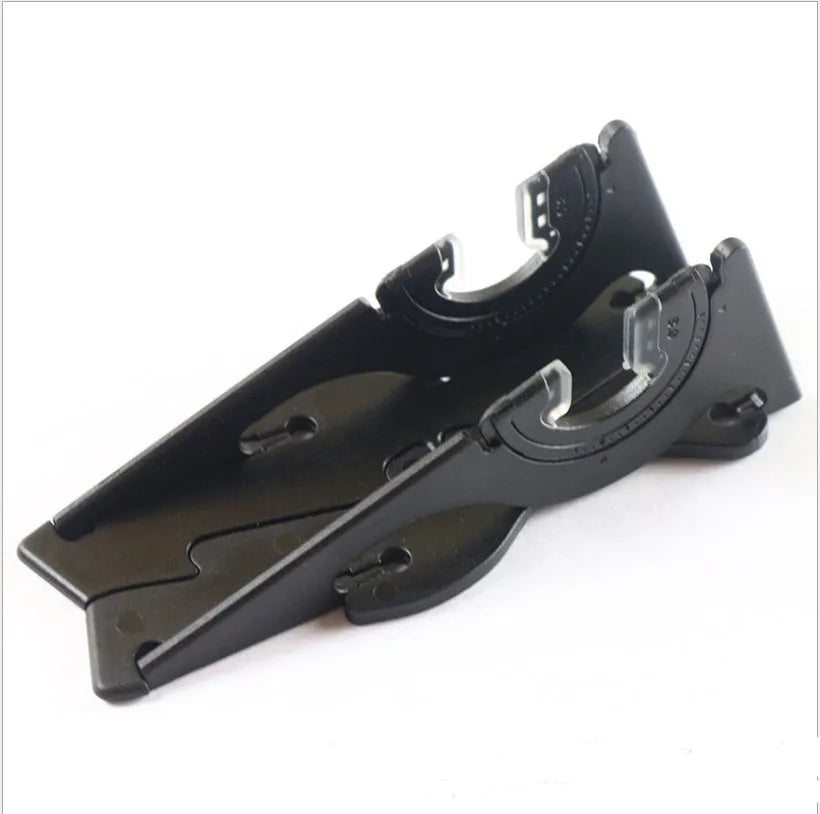 A black plastic card-type mobile phone stand holding a smartphone on a desktop.