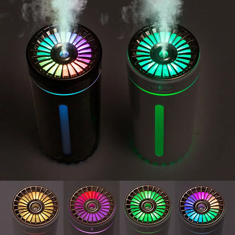 Black portable USB humidifier with colourful lights on a car cup holder.