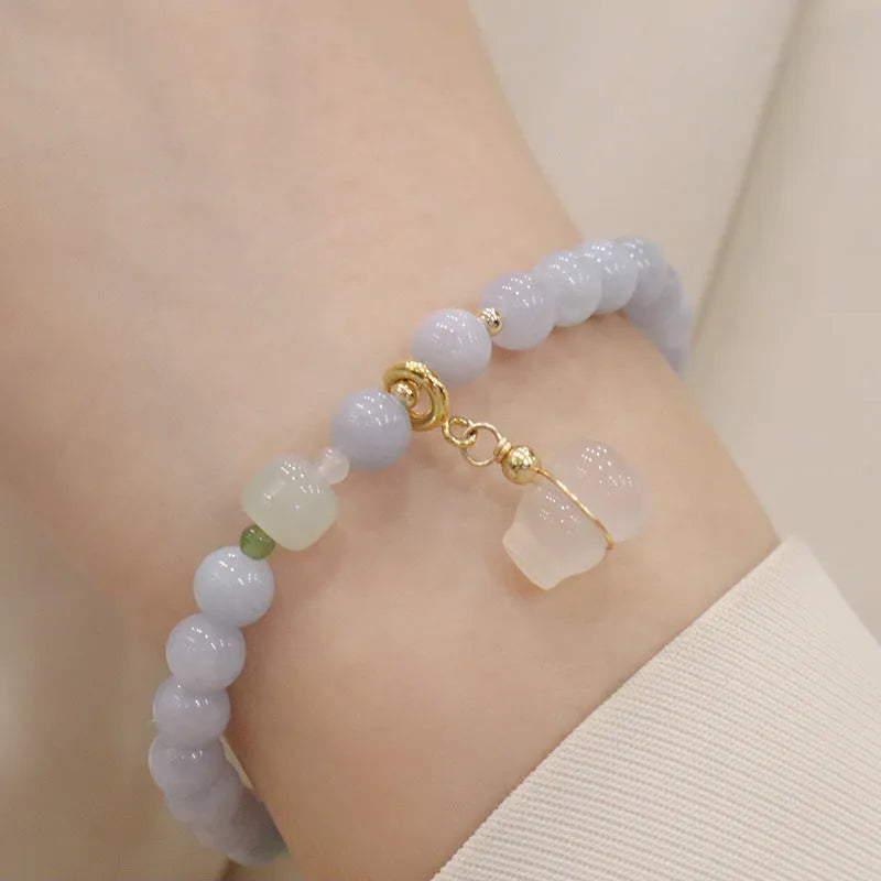 Aquamarine crystal bracelet with gold-plated climbing cat charm for women