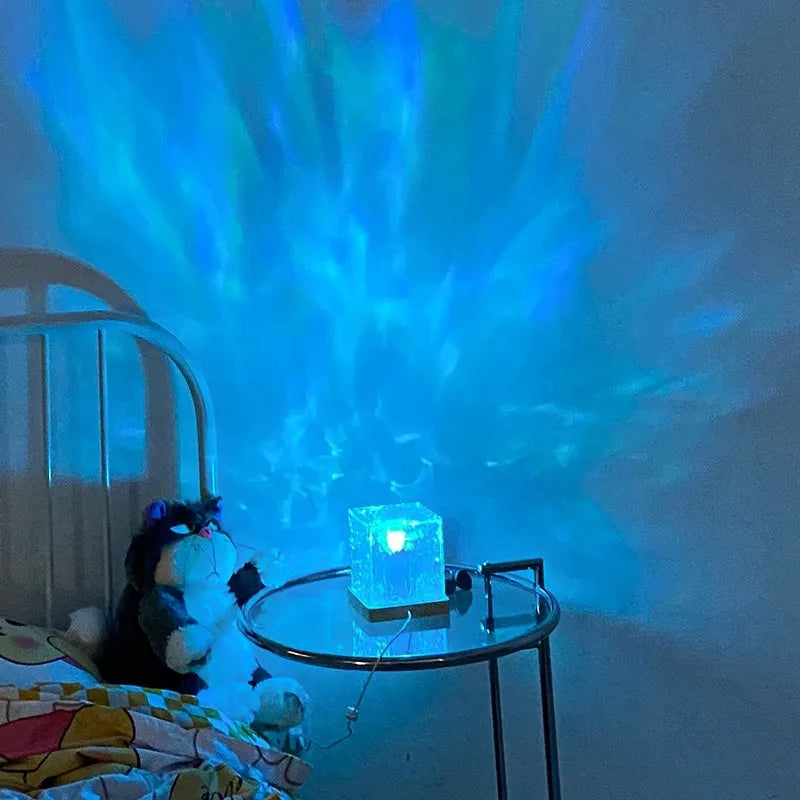 LED water ripple projection night light with remote control on wooden table