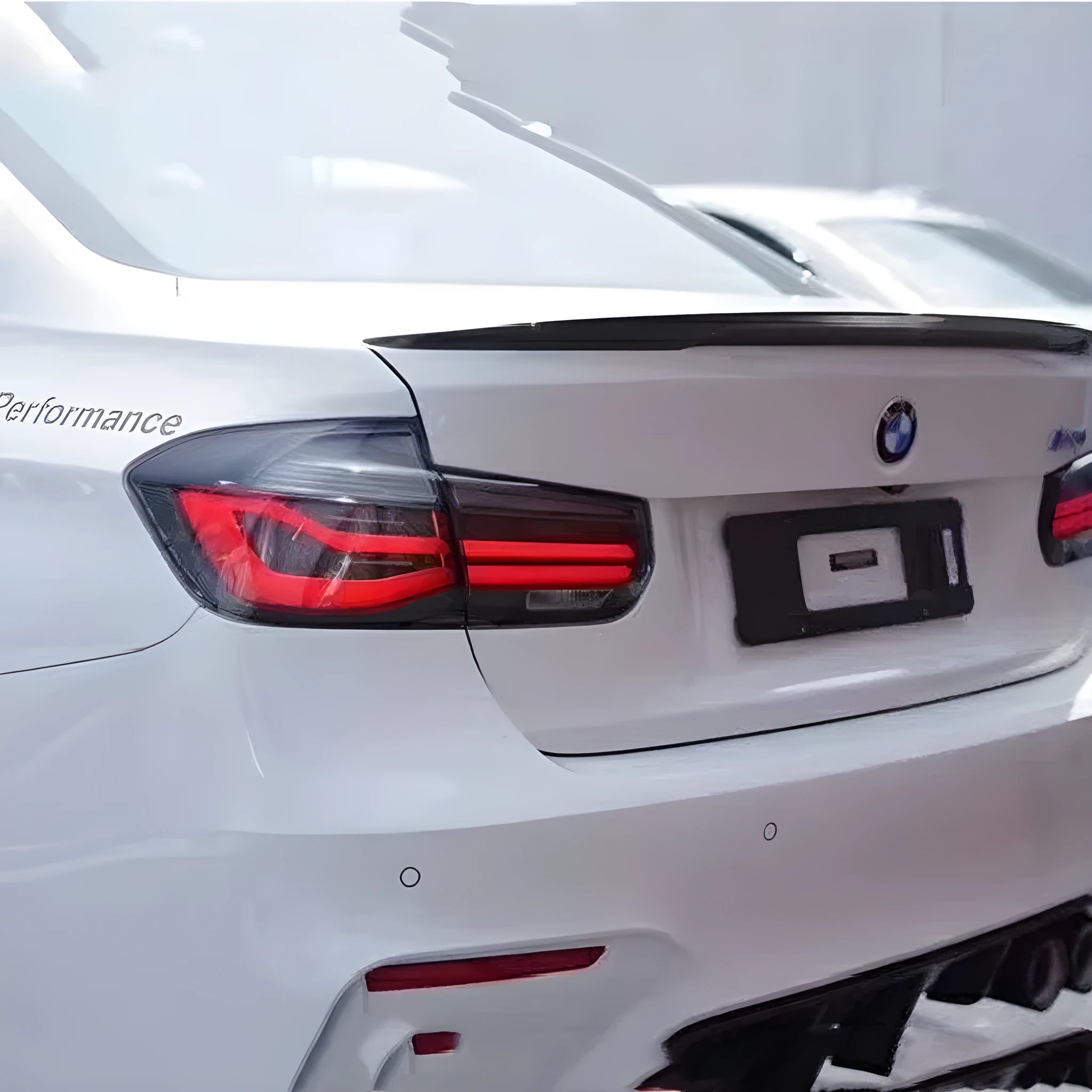 BMW 3 Series modified tail light assembly with LED streamer steering in red or smoked black finish