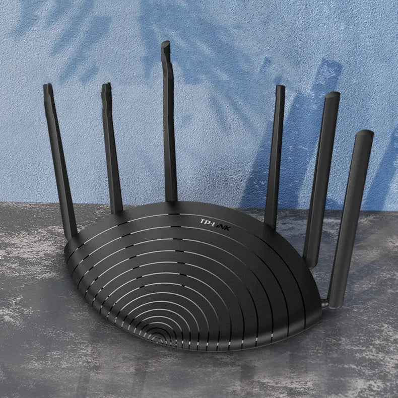 TL-WDR7661 AC1900 Gigabit Dual Band Wireless Router in black chassis on a desk.