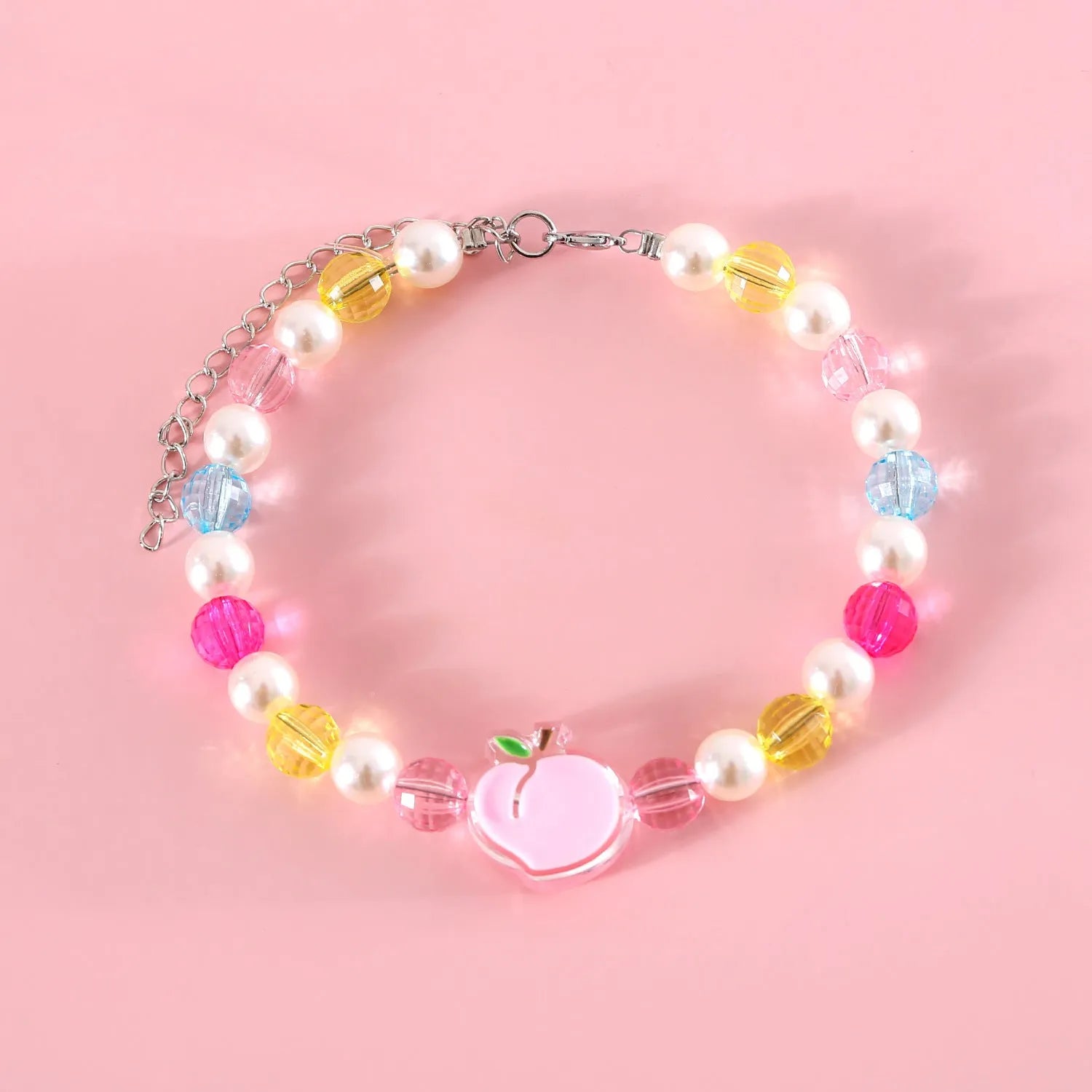 Colourful plastic bead cat necklace showing small flower, rainbow, and peach pattern options with adjustable sizing