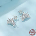 Pair of 925 silver retro pumpkin car stud earrings with romantic French design against a neutral background
