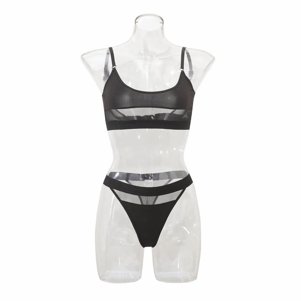 Black and white full cup bra and pants set for women on a hanger.