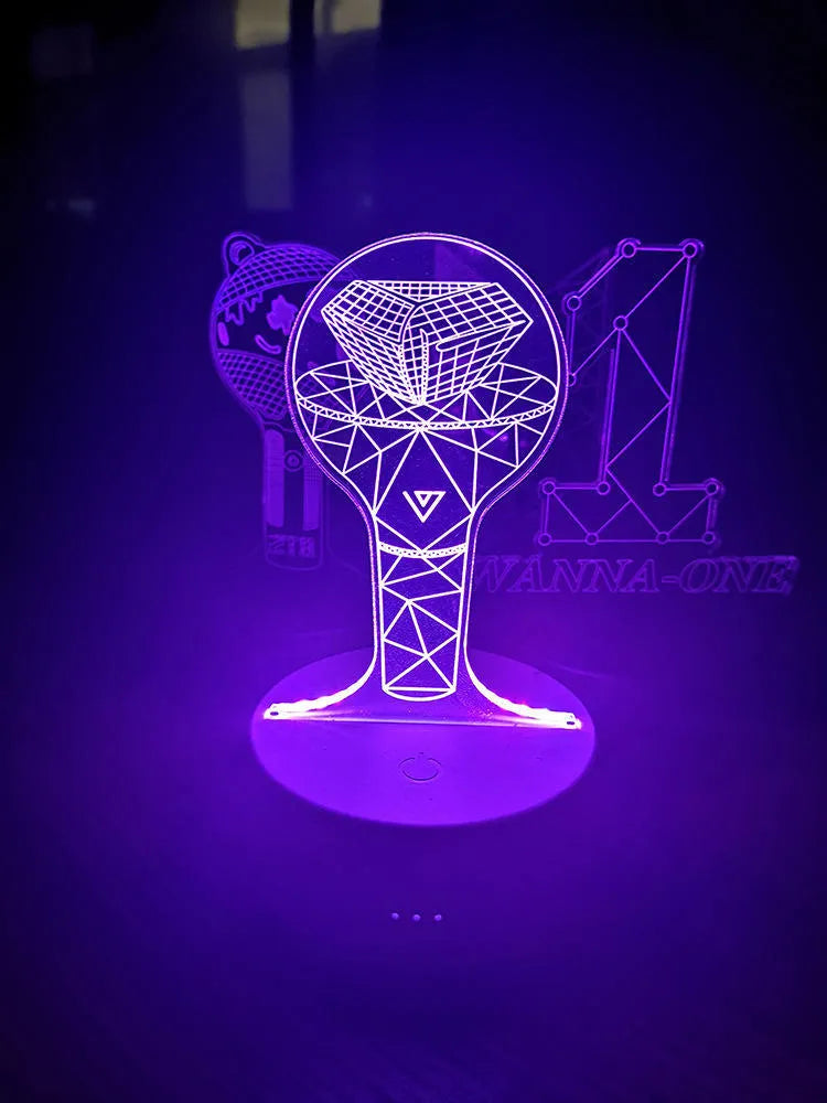 Transparent acrylic display stand showing illuminated BTS Light 101 Tower Gem collectible lamp.