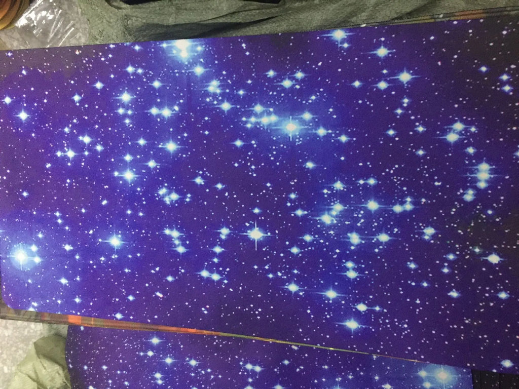 Blue star mouse pad with high-density fabric surface and natural rubber anti-skid base on a desk