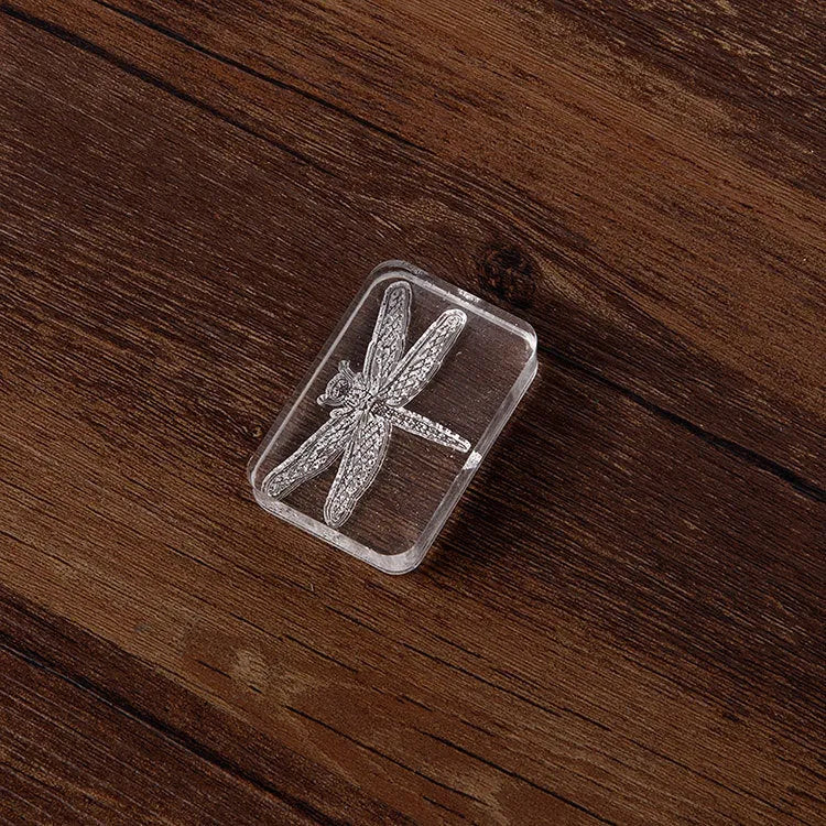 Transparent acrylic seal stamp showing dragonfly pattern with 12mm height and silicone base