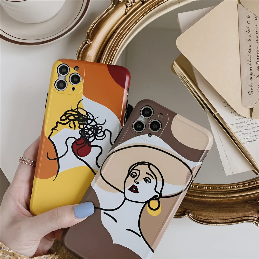 Orange yellow iPhone case with a colourful line painting cartoon design on a soft, textured surface.
