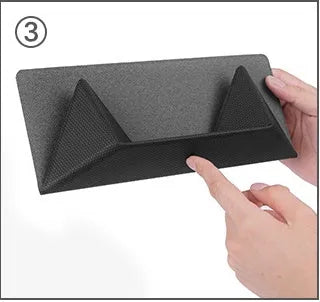 Blue portable laptop cooling bracket with foldable design on a wooden table.
