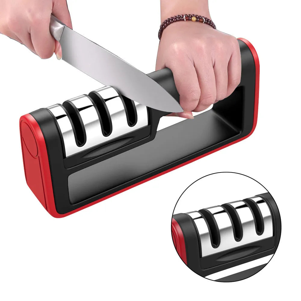 Black and red three-stage professional knife sharpener on a kitchen counter