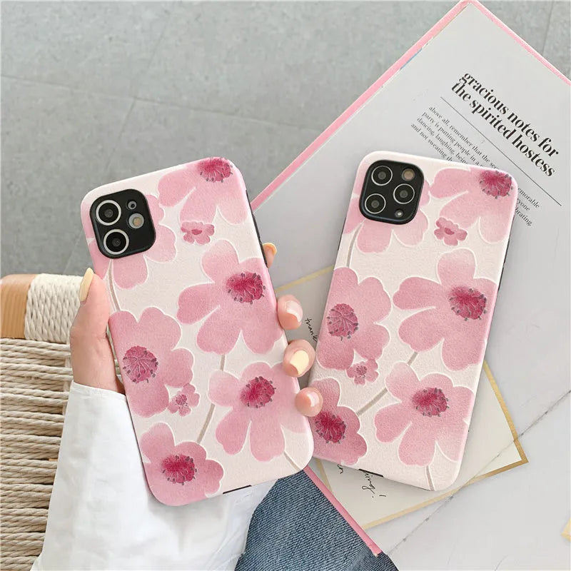 Pink soft rubber iPhone case with Japanese-Korean design showing lanyard hole