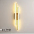 Minimalist Scandinavian-style acrylic LED wall lamp in black or gold, shown in left and right-handed orientations.