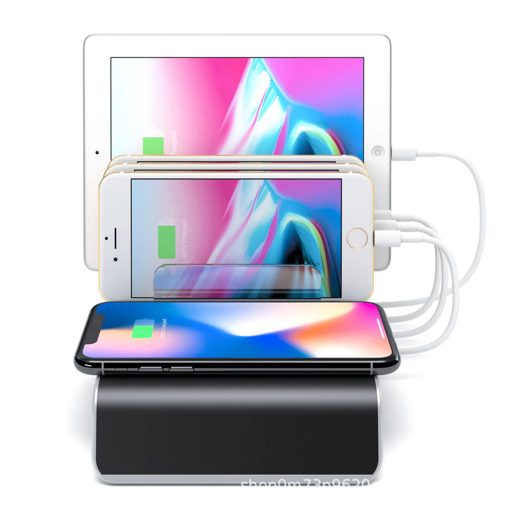 Black universal mobile phone and tablet charging stand base on a desk